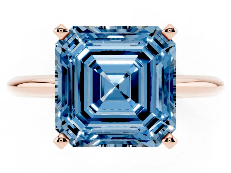 Fancy Blue Asscher Cut Diamond Solitaire Ring Set in Rose gold with Prong Setting on a Plain Round Band