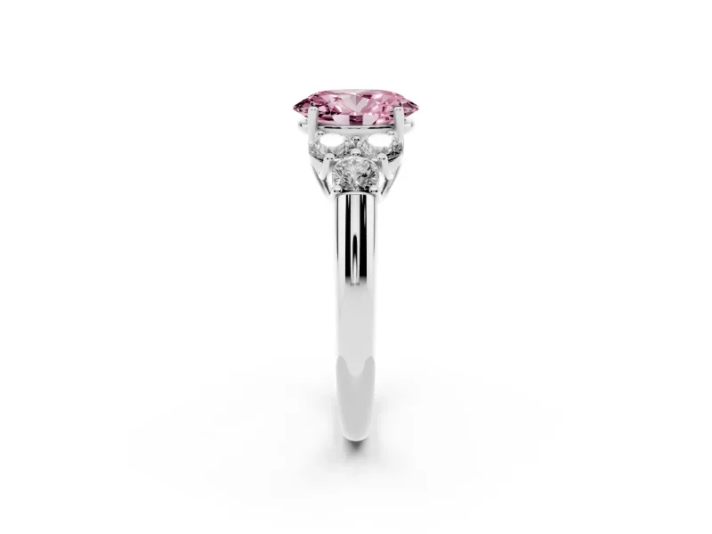 Fancy Pink Oval Cut Diamond Cluster Ring Set in White gold with Round Accent Stones and Prong Setting on a Plain Band