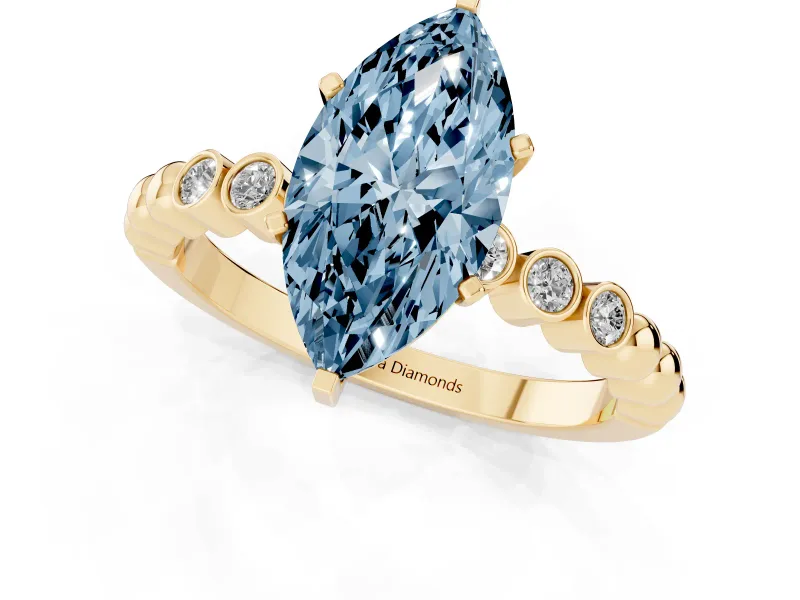 Fancy Blue Marquise Cut Diamond Solitaire Engagement Ring Set in Yellow gold with Bezel Accents on Beaded Band