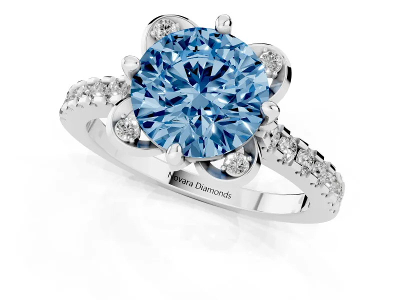 Fancy Blue Round Cut Diamond Solitaire Ring Set in Platinum with Pavé Band and Floral Prong Setting