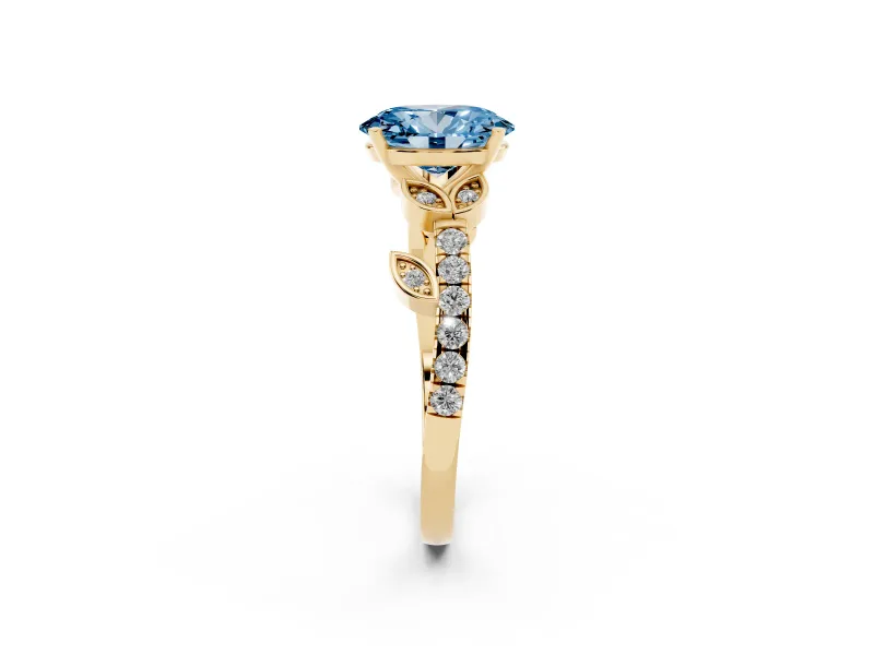 Fancy Blue Oval Cut Diamond Solitaire Leaf-Inspired Ring Set in Yellow gold with Pavé Band and Prong Setting