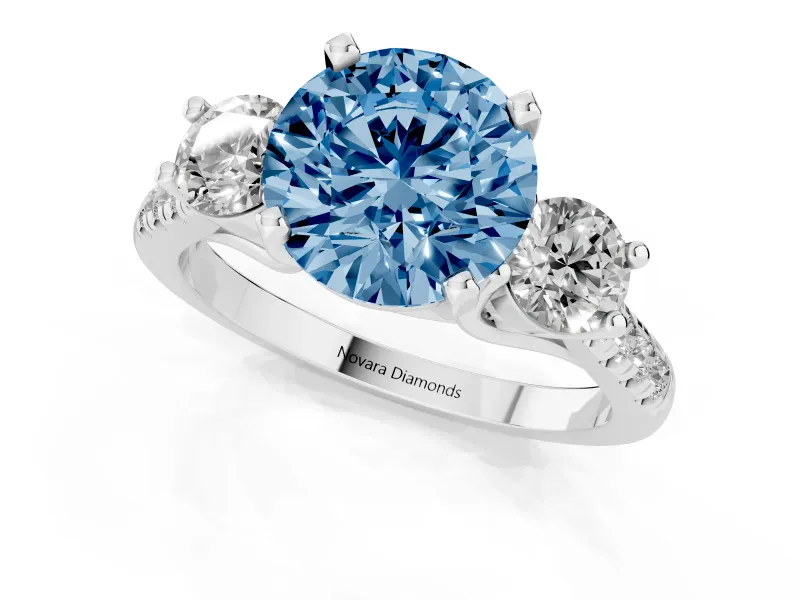 Fancy Blue Three-Stone Round Cut Diamond Pavé Band Ring Set in Platinum with Prong-Set Trio