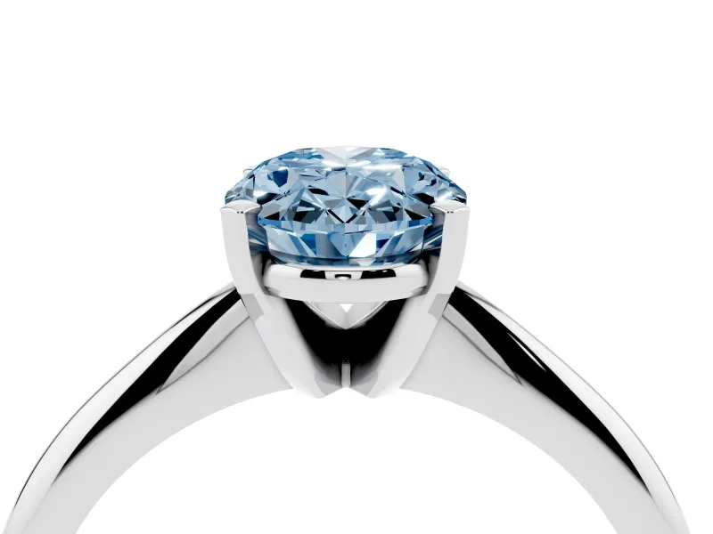Fancy Blue Oval Cut Diamond Solitaire Ring Set in White gold with Prong Setting on a Plain Round Band