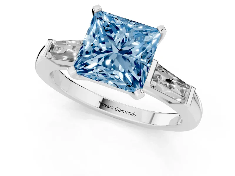 Fancy Blue Princess Cut Diamond Solitaire Ring Set in Silver with Tapered Baguette Side Stones and Prong Setting