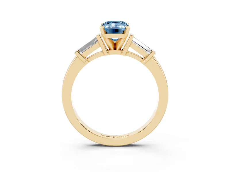 Fancy Blue Emerald Cut Diamond Solitaire Ring Set in Yellow gold with Tapered Baguette Accents and Prong Setting