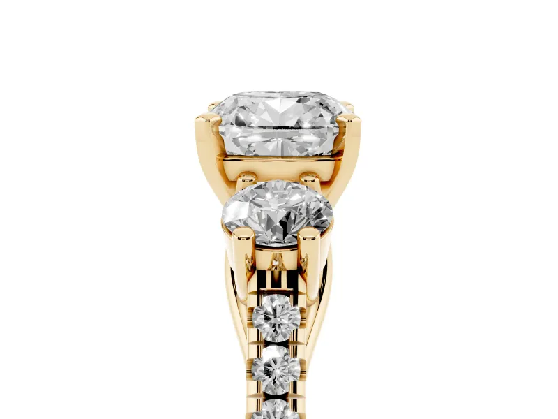 Three-Stone Cushion Cut Diamond Pavé Band Ring Set in Yellow gold with Prong-Set Trio