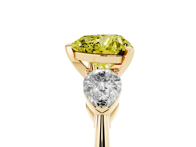 Fancy Yellow Three-Stone Heart Cut Diamond Ring Set in Yellow gold with Pear Side Stones and Prong Setting
