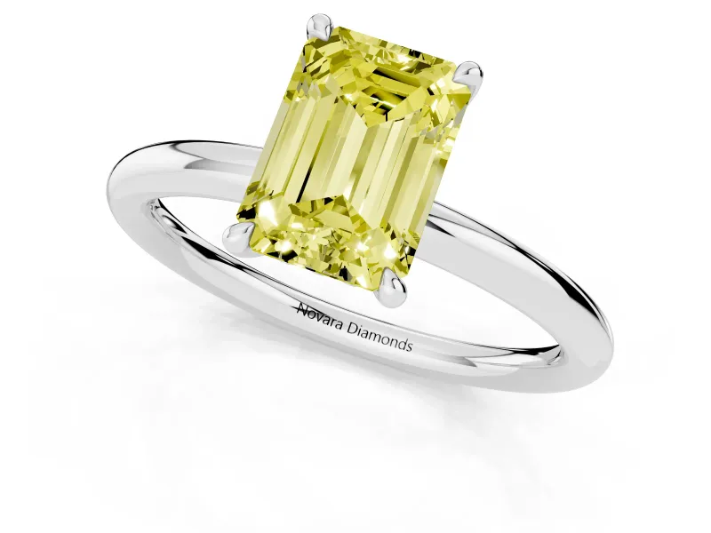 Fancy Yellow Emerald Cut Diamond Solitaire Ring Set in Silver with Thin Band and Prong Setting