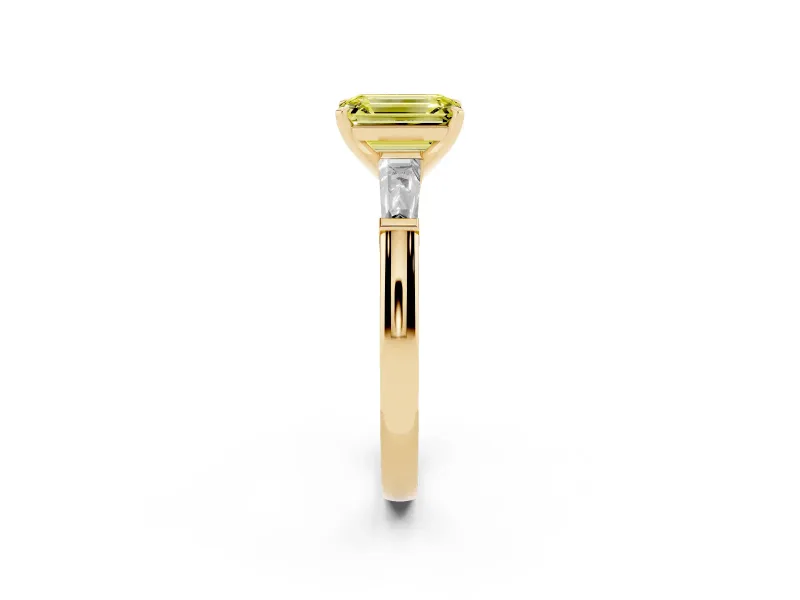 Fancy Yellow Emerald Cut Diamond Solitaire Ring Set in Yellow gold with Tapered Baguette Side Stones and Prong Setting