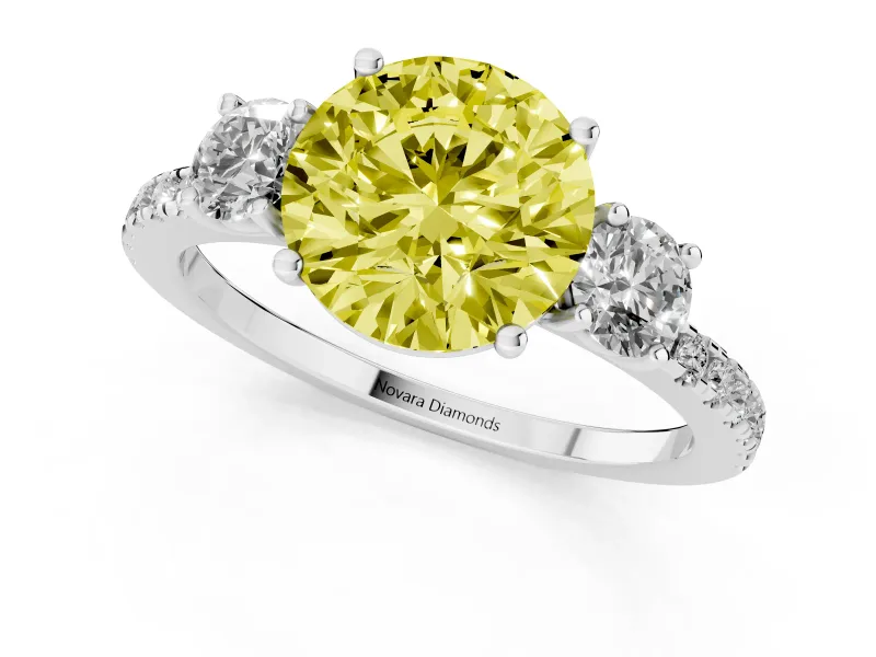 Fancy Yellow Round Cut Diamond Three-Stone Ring Set in Platinum with Pavé Band and Graduated Sides