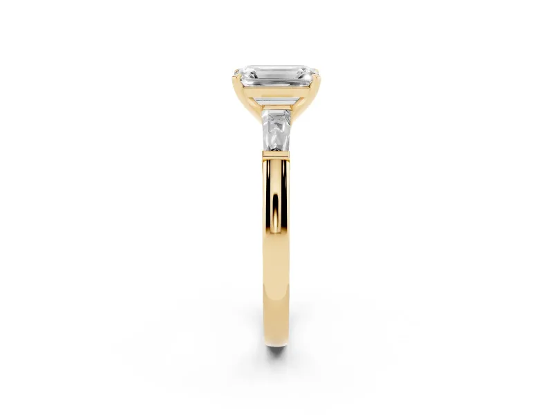 Emerald Cut Diamond Solitaire Ring Set in Yellow gold with Tapered Baguette Side Stones and Prong Setting