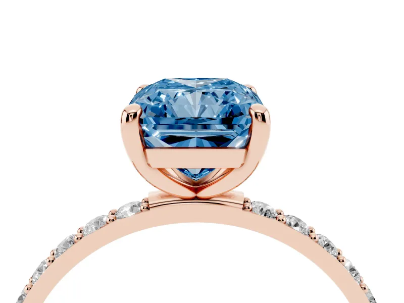 Fancy Blue Radiant Cut Diamond Solitaire Ring Set in Rose gold with Round Pavé Band and Prong Setting