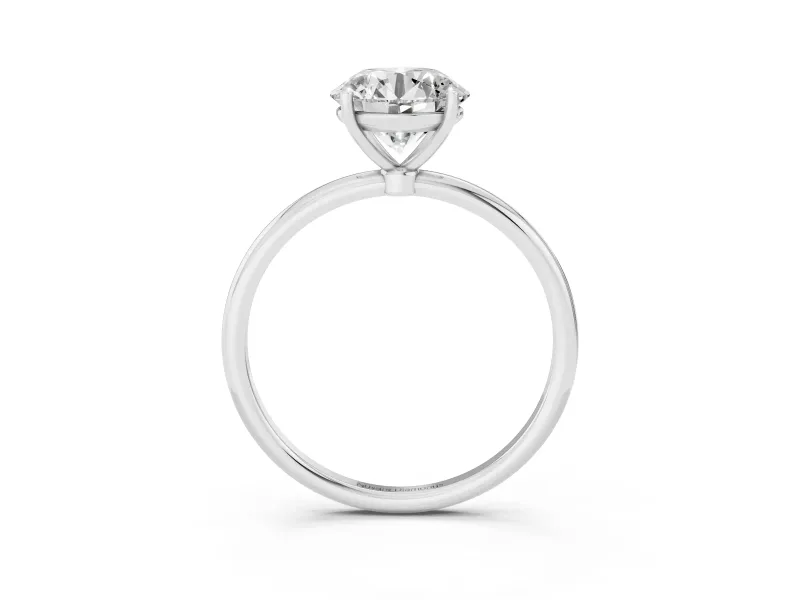 Round Cut Diamond Solitaire Engagement Ring Set in Silver with Thin Band and Prong Setting