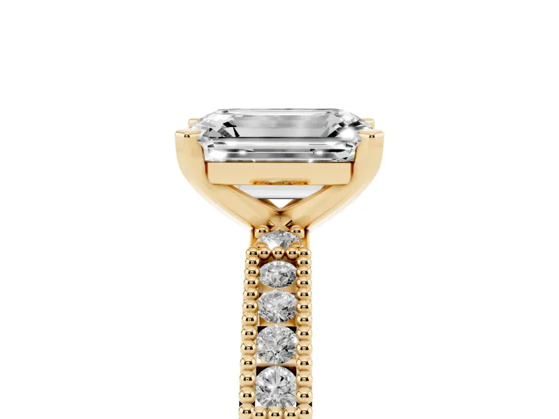 Emerald Cut Diamond Solitaire Ring Set in Yellow gold with Slim Pavé Band and Prong Setting