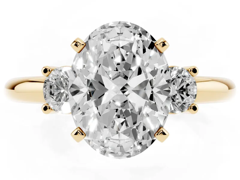 Three-Stone Oval Cut Diamond Ring Set in Yellow gold with Prong Setting and Plain Band
