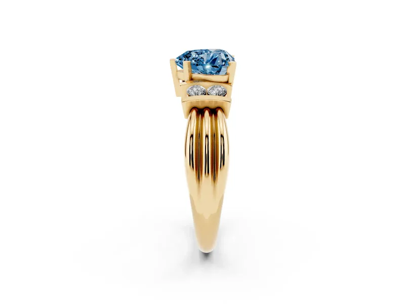 Fancy Blue Three-Stone Heart Cut Diamond Channel Set Ring Set in Yellow gold with Bar Prongs