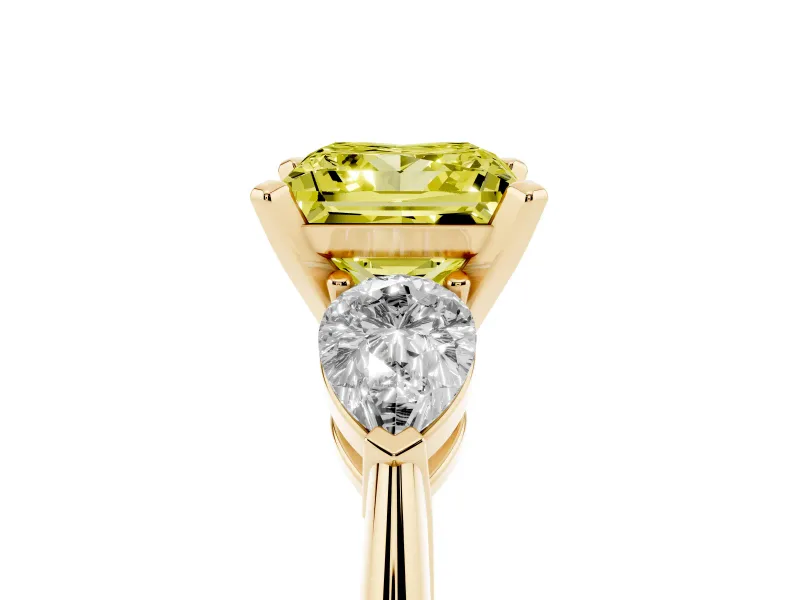 Fancy Yellow Three-Stone Princess Cut Diamond Ring Set in Yellow gold with Pear Side Stones and Prong Setting
