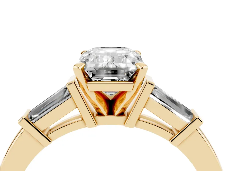 Emerald Cut Diamond Solitaire Ring Set in Yellow gold with Tapered Baguette Accents and Prong Setting