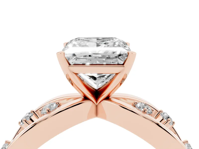Princess Cut Diamond Solitaire Ring Set in Rose gold with Side Stones on Criss-Cross Band and Prong Setting