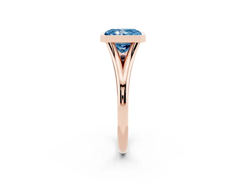 Fancy Blue Bezel Set Radiant Cut Diamond Solitaire Ring Set in Rose gold with Tapered Band