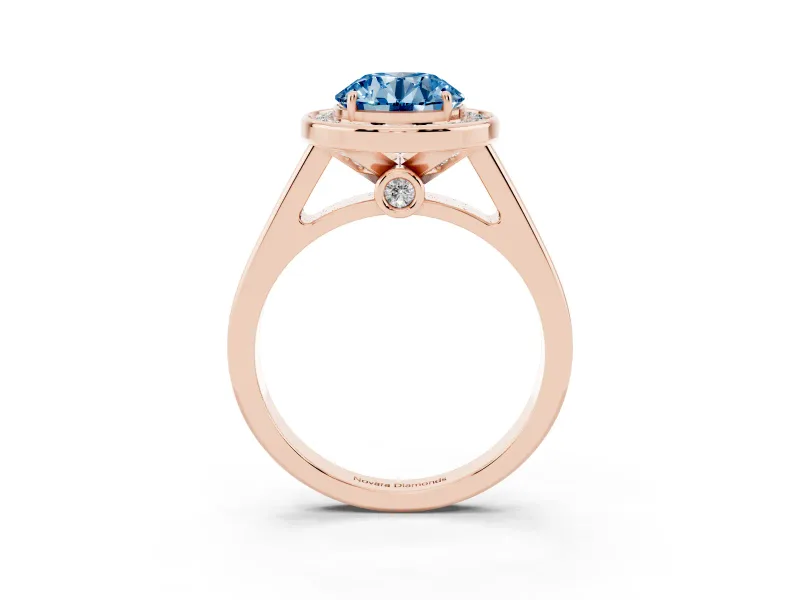 Fancy Blue Round Cut Diamond Halo Solitaire Ring Set in Rose gold with Pavé Band and Bezel Setting