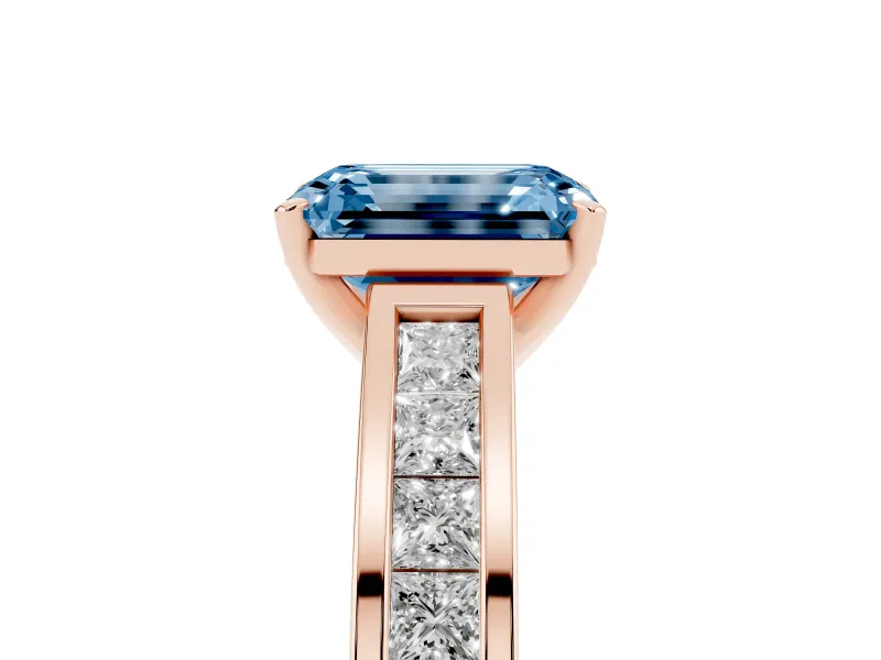 Fancy Blue Emerald Cut Diamond Solitaire Ring Set in Rose gold with Channel-Set Band and Prong Setting