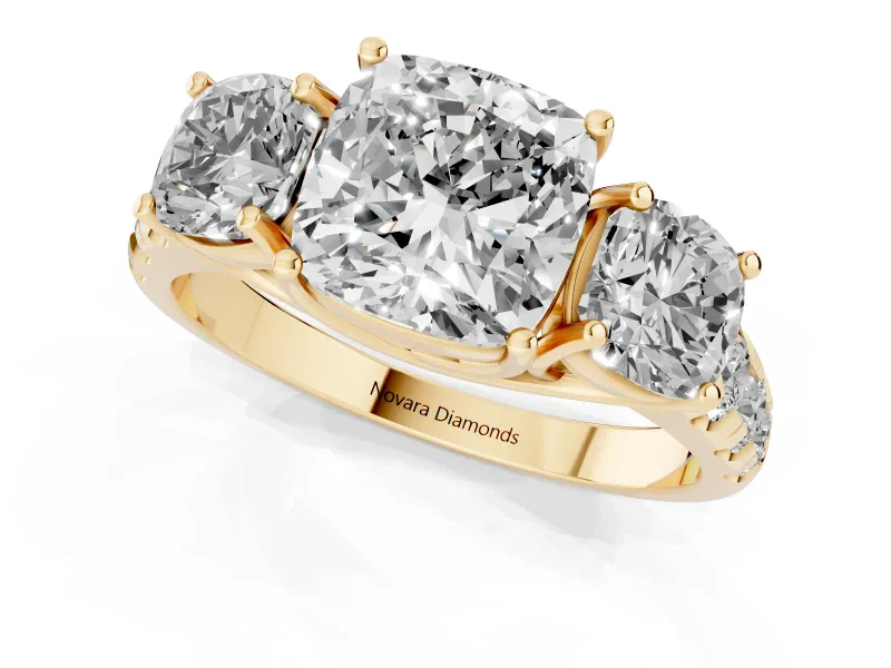 Cushion Cut Diamond Three-Stone Ring Set in Yellow gold with Pavé Band