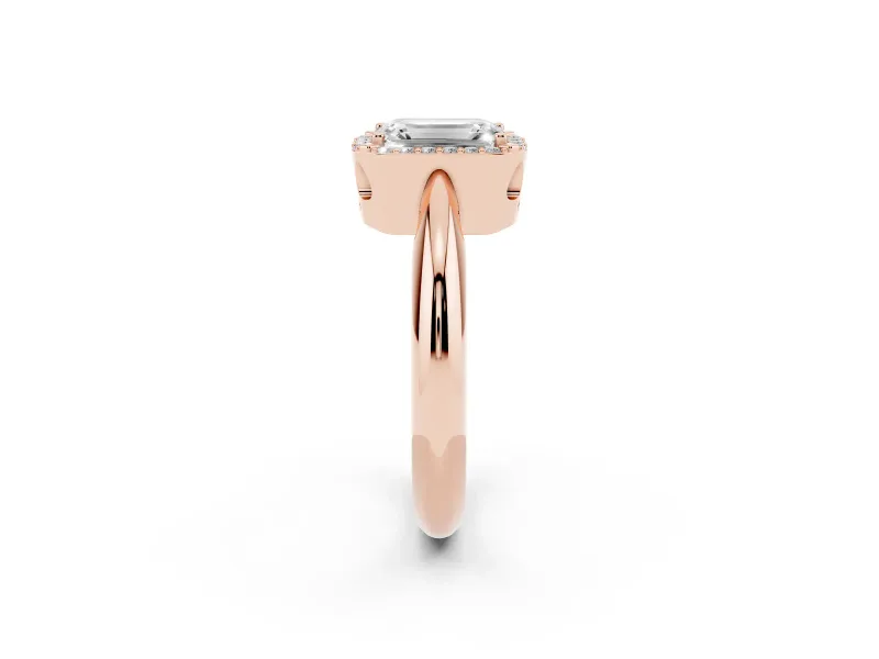Emerald Cut Diamond Halo Engagement Ring Set in Rose gold with Plain Split Shank and Prong Setting