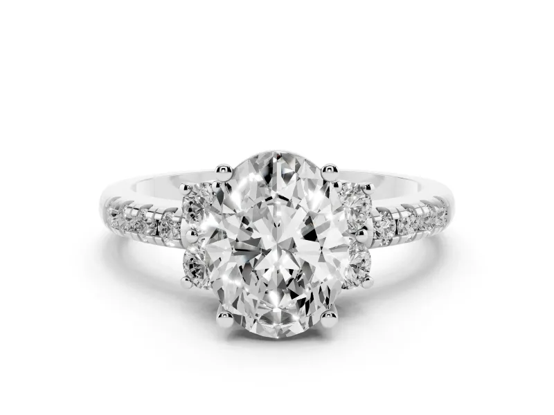 Oval Cut Diamond Three-Stone Pavé Ring Set in Platinum with Prong Setting