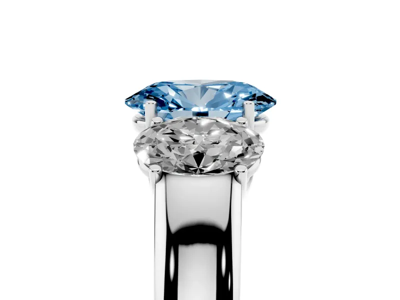 Fancy Blue Three-Stone Oval Cut Diamond Ring Set in Platinum with Matching Prong Settings and Plain Band