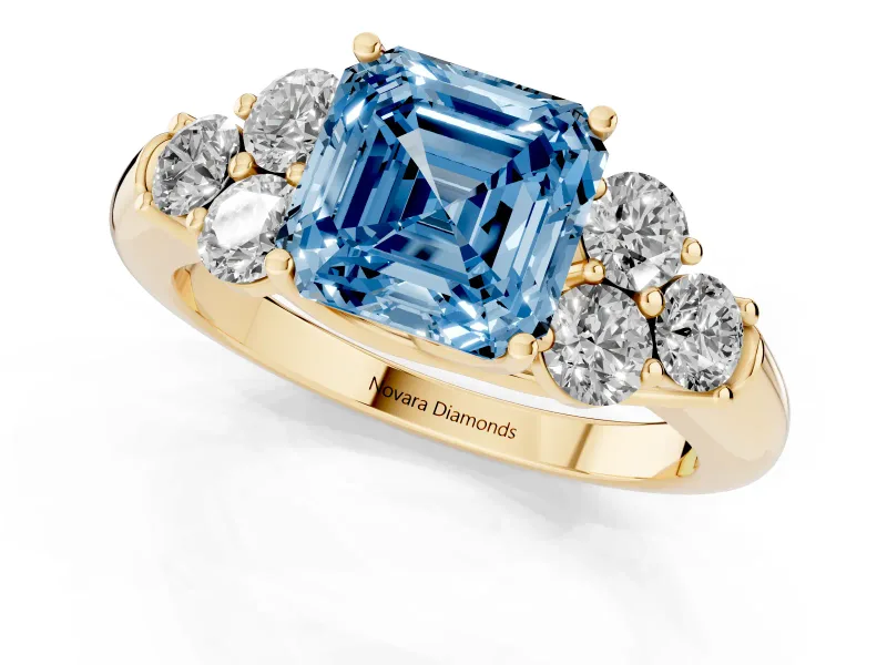 Fancy Blue Asscher Cut Diamond Cluster Ring Set in Yellow gold with Round Accent Stones and Prong Setting on a Plain Band