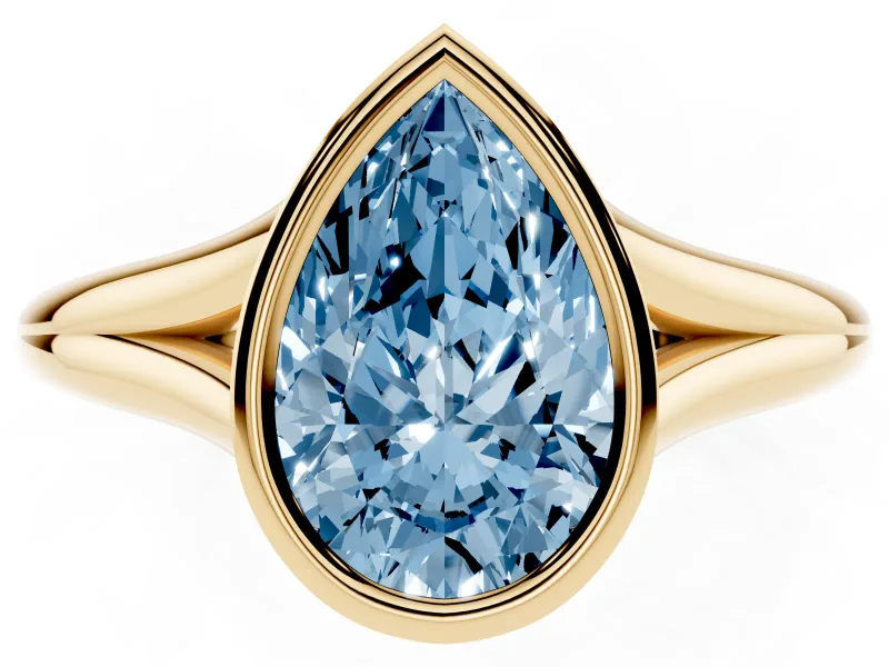 Fancy Blue Bezel Set Pear Cut Diamond Solitaire Ring Set in Yellow gold with Tapered Band
