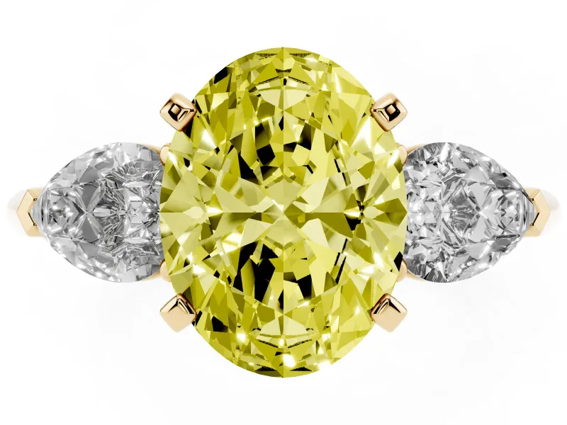 Fancy Yellow Three-Stone Oval Cut Diamond Ring Set in Yellow gold with Pear Side Stones and Prong Setting