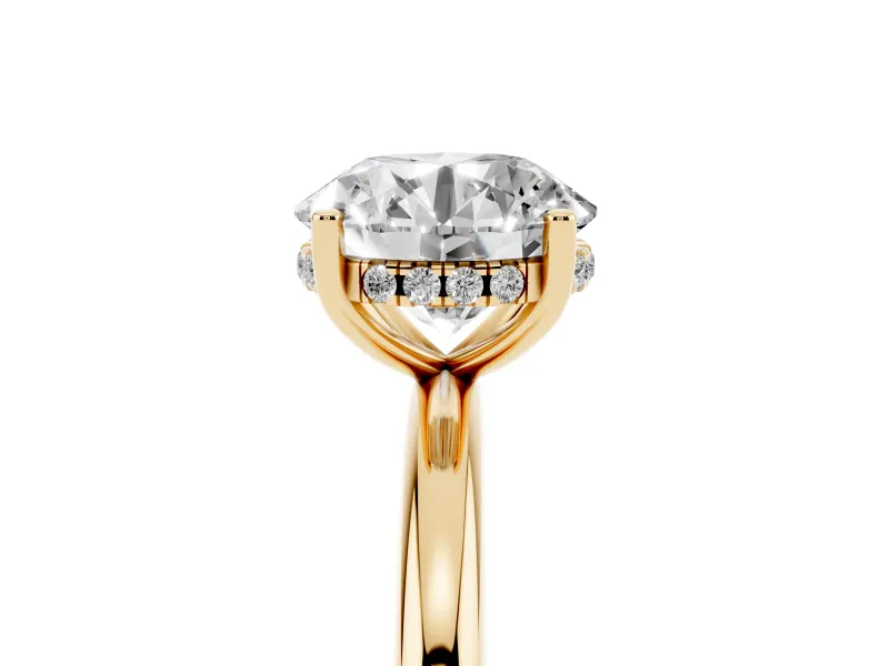 Round Cut Diamond Solitaire Engagement Ring Set in Yellow gold with Prong Setting and Polished Band