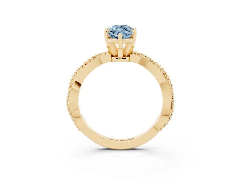 Fancy Blue Marquise Cut Diamond Solitaire Ring Set in Yellow gold with Twisted Band and Bead Prong Setting