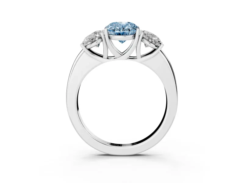 Fancy Blue Oval Cut Diamond Three-Stone Ring Set in Platinum with Bold Center and Classic Band