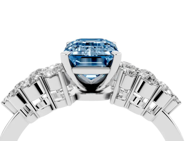 Fancy Blue Emerald Cut Diamond Cluster Engagement Ring Set in White gold with Pavé Band and Prong Setting