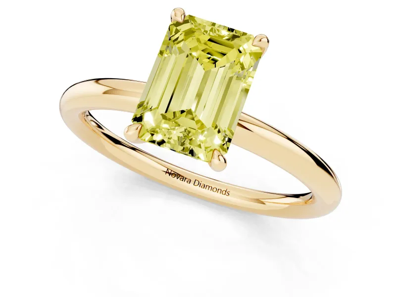 Fancy Yellow Emerald Cut Diamond Solitaire Ring Set in Yellow gold with Thin Band and Prong Setting