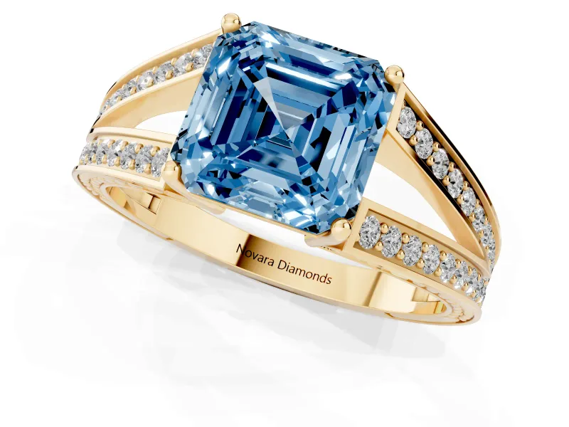 Fancy Blue Asscher Cut Diamond Split Shank Ring Set in Yellow gold with Pavé Band and Prong Setting