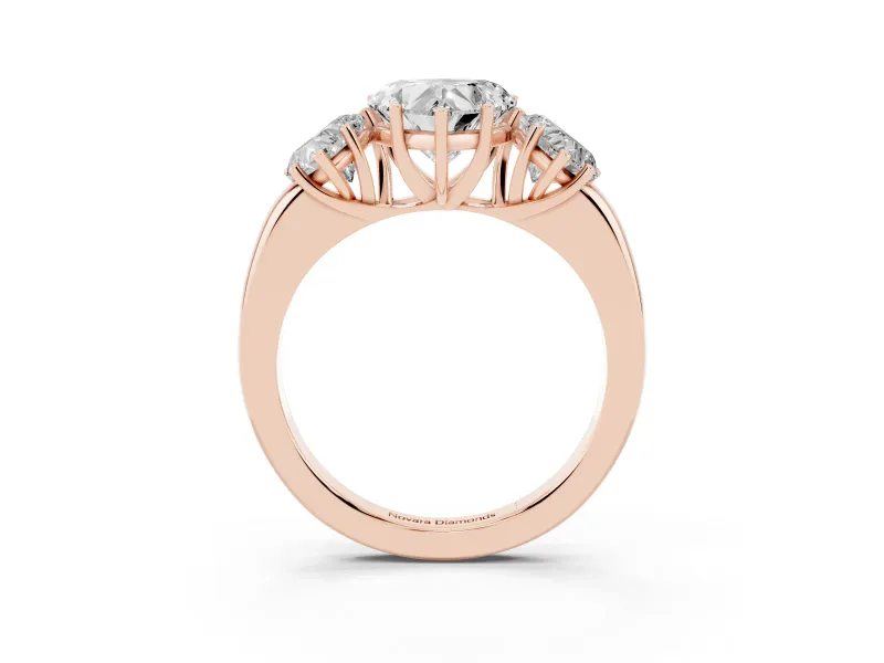 Heart Cut Diamond Three-Stone Ring Set in Rose gold with Bold Center and Classic Band