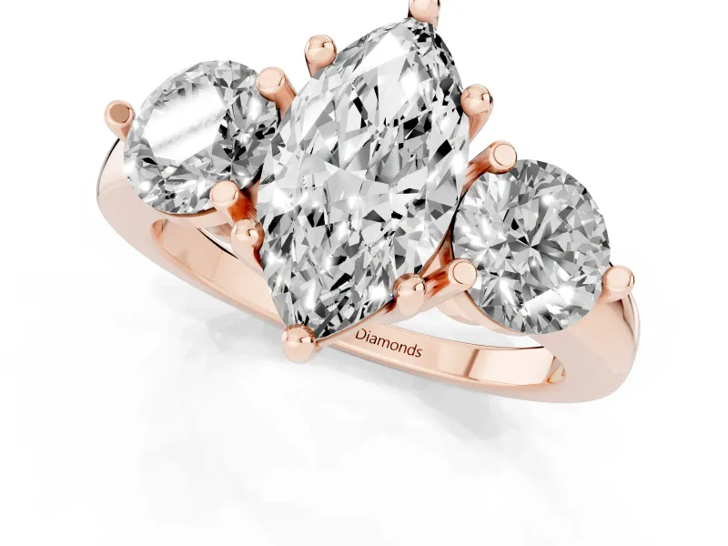 Marquise Cut Diamond Three-Stone Ring Set in Rose gold with Prong Setting and Classic Band