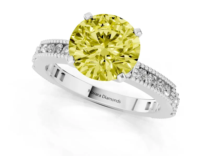 Fancy Yellow Round Cut Diamond Solitaire Ring Set in Platinum with Slim Pavé Band and Prong Setting