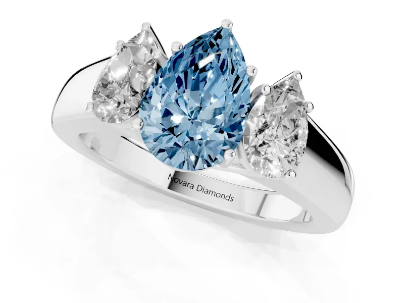 Fancy Blue Three-Stone Pear Cut Diamond Ring Set in Silver with Matching Prong Settings and Plain Band