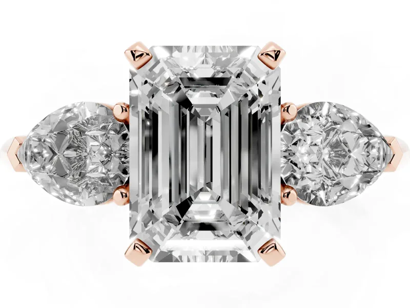 Three-Stone Emerald Cut Diamond Ring Set in Rose gold with Pear Side Stones and Prong Setting