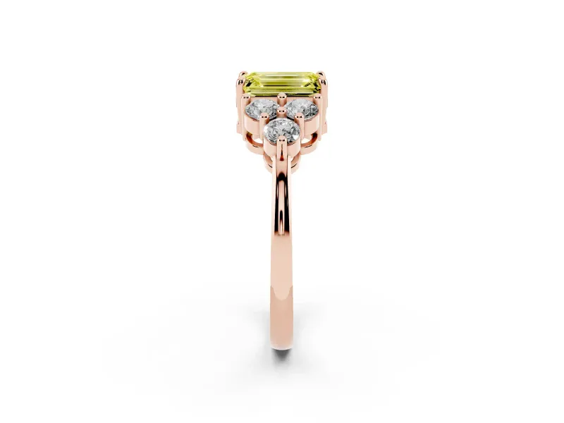Fancy Yellow Emerald Cut Diamond Solitaire Ring Set in Rose gold with Cluster Accents on Each Side