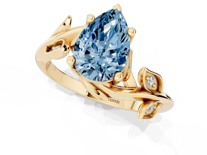 Fancy Blue Pear Cut Diamond Solitaire Twist Engagement Ring Set in Yellow gold with Pavé Leaf Accents