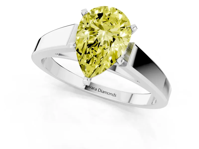 Fancy Yellow Pear Cut Diamond Solitaire Engagement Ring Set in Platinum with Prong Setting and Tapered Band