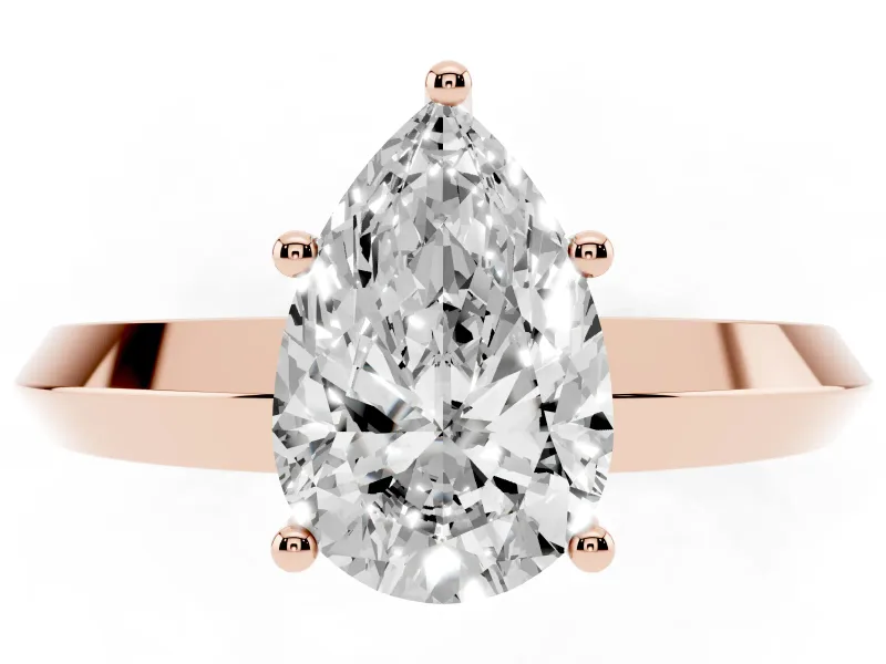 Pear Cut Diamond Solitaire Engagement Ring Set in Rose gold with Flat Band and Prong Setting