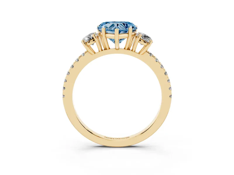 Fancy Blue Heart Cut Diamond Three-Stone Ring Set in Yellow gold with Pavé Band and Graduated Sides