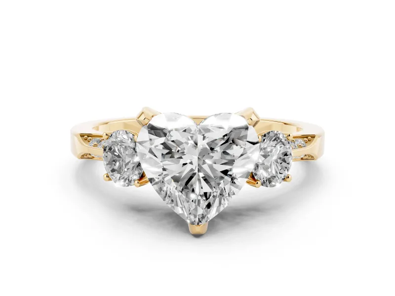 Heart Cut Diamond Three-Stone Ring Set in Yellow gold with Pavé Band and Smaller Side Stones
